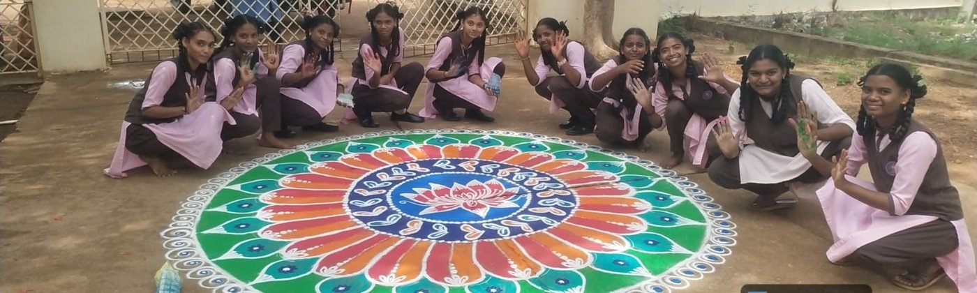 Students with rangoli at the school gate